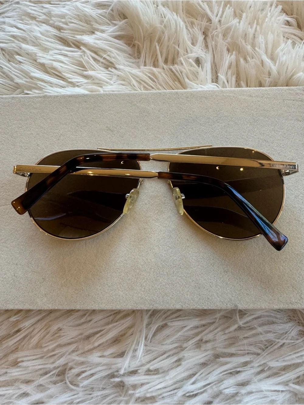 Calvin Klein Gold Unisex Aviator Sunglasses with Brown Lenses